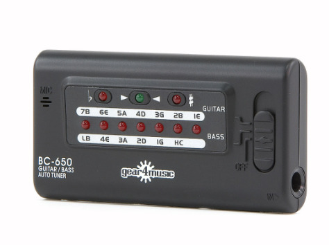 A picture of a digital tuner on a guitar picking up the G string